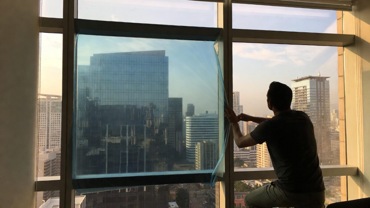 person-installing-commercial-window-film-image